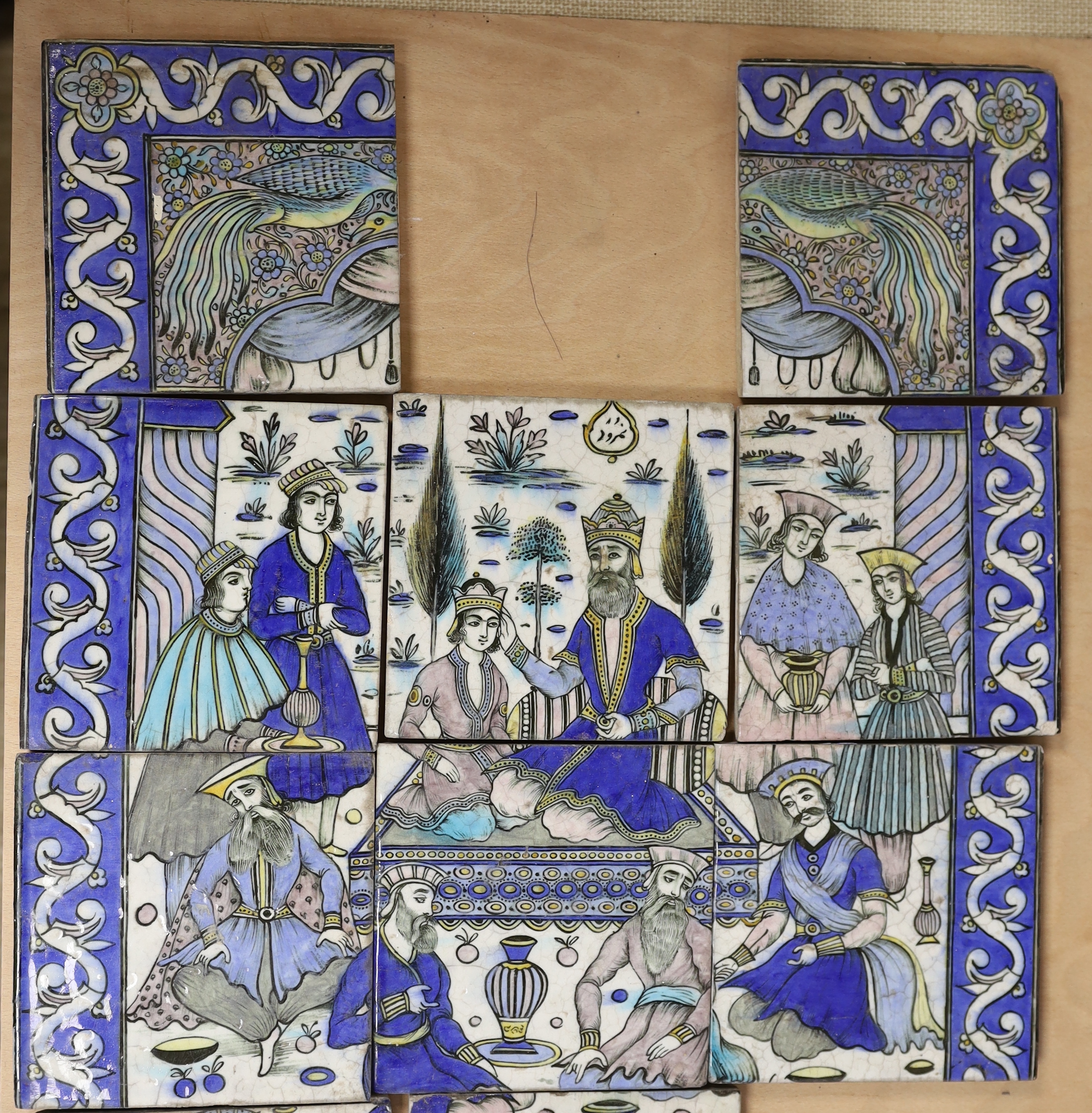 A collection of 20th century Persian tiles as a figurative panel, (two tiles missing) together with four other others from a similar panel, larger panel approximately 86.5cm high x 45cm wide